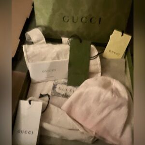 Authentic Gucci hat beautiful subtle colors of pink and white.